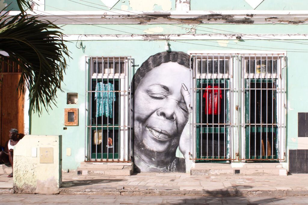 street art on a blue store building of the famous singer cesaria evora in santa maria, sal, cabo verde